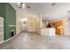 Spacious living room with tile floors, a fireplace, and an open layout leading to the kitchen at 14155 Portrush Dr, Orlando, FL 32828
