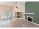 Comfortable living room featuring tile flooring, a fireplace, custom built-ins, and sliding glass doors to the patio at 14155 Portrush Dr, Orlando, FL 32828