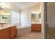 Main bathroom features double sinks, soaking tub, separate shower and tiled flooring at 14155 Portrush Dr, Orlando, FL 32828