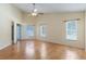 Spacious main bedroom with vaulted ceiling, ceiling fan, laminate flooring, and natural light at 14155 Portrush Dr, Orlando, FL 32828