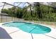 This view of the enclosed pool highlights a smooth surface and fenced area at 14155 Portrush Dr, Orlando, FL 32828