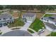 Aerial view of a well-manicured home with green grass and a long driveway at 1541 Tali Ln, Mount Dora, FL 32757