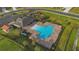 Aerial view of community amenities with pool, playground, and seating, perfect for residents at 1541 Tali Ln, Mount Dora, FL 32757