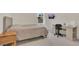 Comfortable bedroom with a work desk, bed, desk, and a large window at 1541 Tali Ln, Mount Dora, FL 32757