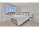 Bedroom featuring a bright window and comfortable, stylish bed at 1541 Tali Ln, Mount Dora, FL 32757