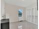 Bedroom showcasing white cabinets, tile floor, and a bright window at 1541 Tali Ln, Mount Dora, FL 32757