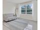Living room featuring tile floors, large window, and a comfortable sofa at 1541 Tali Ln, Mount Dora, FL 32757