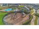 Community playground with swings and slides, perfect for Gathering fun and recreation at 1541 Tali Ln, Mount Dora, FL 32757