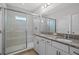 Bathroom boasts granite countertop, double vanity, and a large shower area at 15651 Kinnow Mandarin Ln, Winter Garden, FL 34787