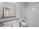 Bathroom featuring granite countertops, a shower and tub combo and updated fixtures offers a spa-like experience at 15651 Kinnow Mandarin Ln, Winter Garden, FL 34787