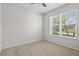 A bright bedroom with a large window, offering lots of natural light at 15651 Kinnow Mandarin Ln, Winter Garden, FL 34787