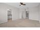 Spacious bedroom with access to a full bathroom, walk-in closet and lots of sunlight at 15651 Kinnow Mandarin Ln, Winter Garden, FL 34787