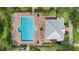 Aerial view of the community pool with ample lounge seating and covered area at 15651 Kinnow Mandarin Ln, Winter Garden, FL 34787