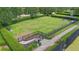 Aerial view of a fenced dog park with green space, picnic area, and walking paths at 15651 Kinnow Mandarin Ln, Winter Garden, FL 34787