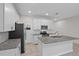 White cabinets, granite counters, and stainless appliances at 15651 Kinnow Mandarin Ln, Winter Garden, FL 34787