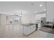An open floorplan living space with tile floors and natural light at 15651 Kinnow Mandarin Ln, Winter Garden, FL 34787