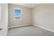 Bright bedroom with a window view and neutral carpet and wall color, creating a peaceful retreat at 16460 Silver Brook Way, Winter Garden, FL 34787