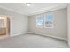 Inviting bedroom features soft carpet and has a view to the adjoining bathroom at 16460 Silver Brook Way, Winter Garden, FL 34787