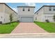 Charming two-story home with a brick driveway and manicured lawn at 16460 Silver Brook Way, Winter Garden, FL 34787