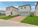 Beautiful two-story home boasts a brick driveway and a well-maintained lawn at 16460 Silver Brook Way, Winter Garden, FL 34787