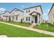 Inviting two-story home with a well-maintained lawn and charming front porch, perfect for a growing Gathering at 16460 Silver Brook Way, Winter Garden, FL 34787