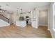 A spacious, open-concept kitchen featuring white cabinets, a center island, and sleek, modern appliances at 16460 Silver Brook Way, Winter Garden, FL 34787