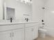 Bathroom featuring double vanity, stone countertop, black hardware, and a bath and shower combo at 16544 Silver Brook Way, Winter Garden, FL 34787
