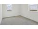 Spacious bedroom featuring windows and neutral carpet at 16544 Silver Brook Way, Winter Garden, FL 34787