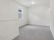 Empty bedroom with neutral carpet and base molding, and natural light at 16544 Silver Brook Way, Winter Garden, FL 34787