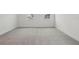 Neutral carpeted bedroom with natural light and base molding at 16544 Silver Brook Way, Winter Garden, FL 34787