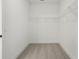 Walk-in closet offering wire shelving for organized storage at 16544 Silver Brook Way, Winter Garden, FL 34787