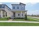 Charming two-story home featuring a covered front porch and nicely manicured landscaping at 16544 Silver Brook Way, Winter Garden, FL 34787
