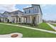Charming two-story home with a covered porch, nicely manicured lawn, and landscaping at 16544 Silver Brook Way, Winter Garden, FL 34787
