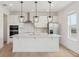 Modern kitchen featuring stainless steel appliances, pendant lighting, and an island at 16544 Silver Brook Way, Winter Garden, FL 34787