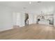 Open-concept living space with wood floors and staircase leading to the upper level at 16544 Silver Brook Way, Winter Garden, FL 34787
