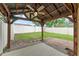 Backyard featuring a wooden structure with ceiling fan, a green lawn, and white fencing at 1774 Peterson Pl, Sanford, FL 32773
