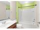 Cozy bathroom with a tub-shower combination, a single vanity and neutral color palette at 1774 Peterson Pl, Sanford, FL 32773