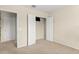 Clean bedroom space with neutral walls, carpeted floors, and a closet with open doors at 1774 Peterson Pl, Sanford, FL 32773