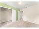 Bedroom with closet, neutral carpet, light walls, and access to other areas of the home at 1774 Peterson Pl, Sanford, FL 32773