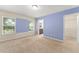 Bedroom featuring carpet, natural light, and a walk-in closet at 1774 Peterson Pl, Sanford, FL 32773