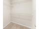 Walk-in closet with white wire shelving and carpeted floor at 1774 Peterson Pl, Sanford, FL 32773
