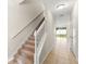 Hallway with stairs, tile floor, and view to the outside at 1774 Peterson Pl, Sanford, FL 32773