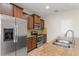Modern kitchen with stainless steel appliances and granite countertops at 1774 Peterson Pl, Sanford, FL 32773