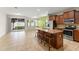Spacious kitchen with an island, stainless steel appliances, and ample cabinet space at 1774 Peterson Pl, Sanford, FL 32773