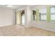 Bright, spacious living room featuring tile floors, large sliding glass doors, and natural light at 1774 Peterson Pl, Sanford, FL 32773