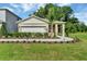 Charming single-story home featuring a two-car garage and beautifully landscaped front yard at 1842 Waggoner St, Kissimmee, FL 34744