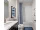 Clean bathroom featuring a shower-tub combo, with a modern vanity and framed art at 1845 La Escalera Rd, Kissimmee, FL 34744