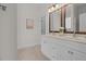 Bathroom featuring double sinks and granite countertops at 19204 Paddock St, Orlando, FL 32833