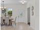 Bright dining room with a modern chandelier, stylish decor, and a view of the outdoors at 19204 Paddock St, Orlando, FL 32833