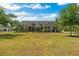 Charming single-Gathering home featuring a well-maintained lawn, mature trees, and a welcoming entrance at 19204 Paddock St, Orlando, FL 32833